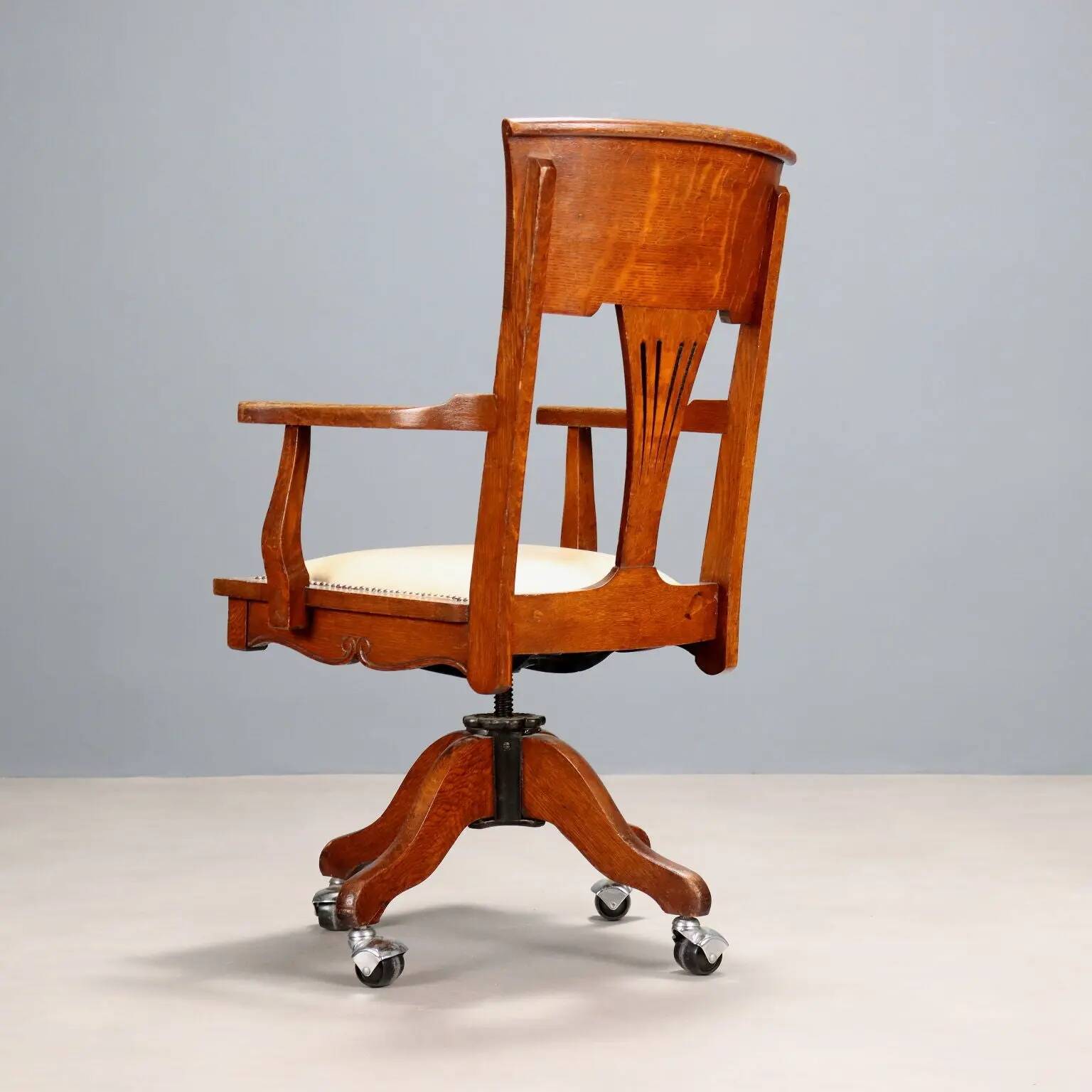 Antique oak swivel chair with wheels UK 20th Century