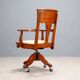 Antique oak swivel chair with wheels UK 20th Century