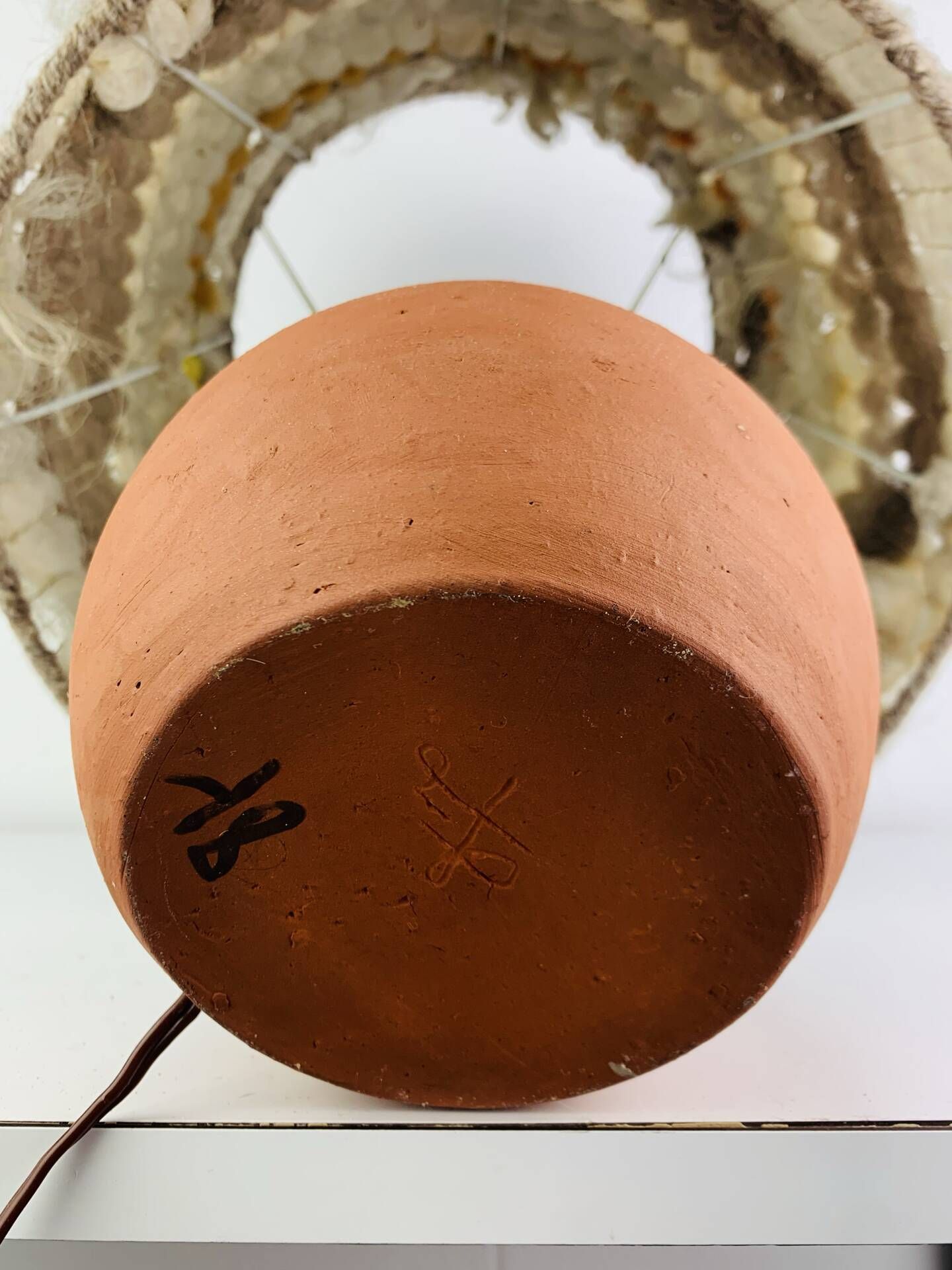Terracotta globe lamp with a wool shade from the 1960s.