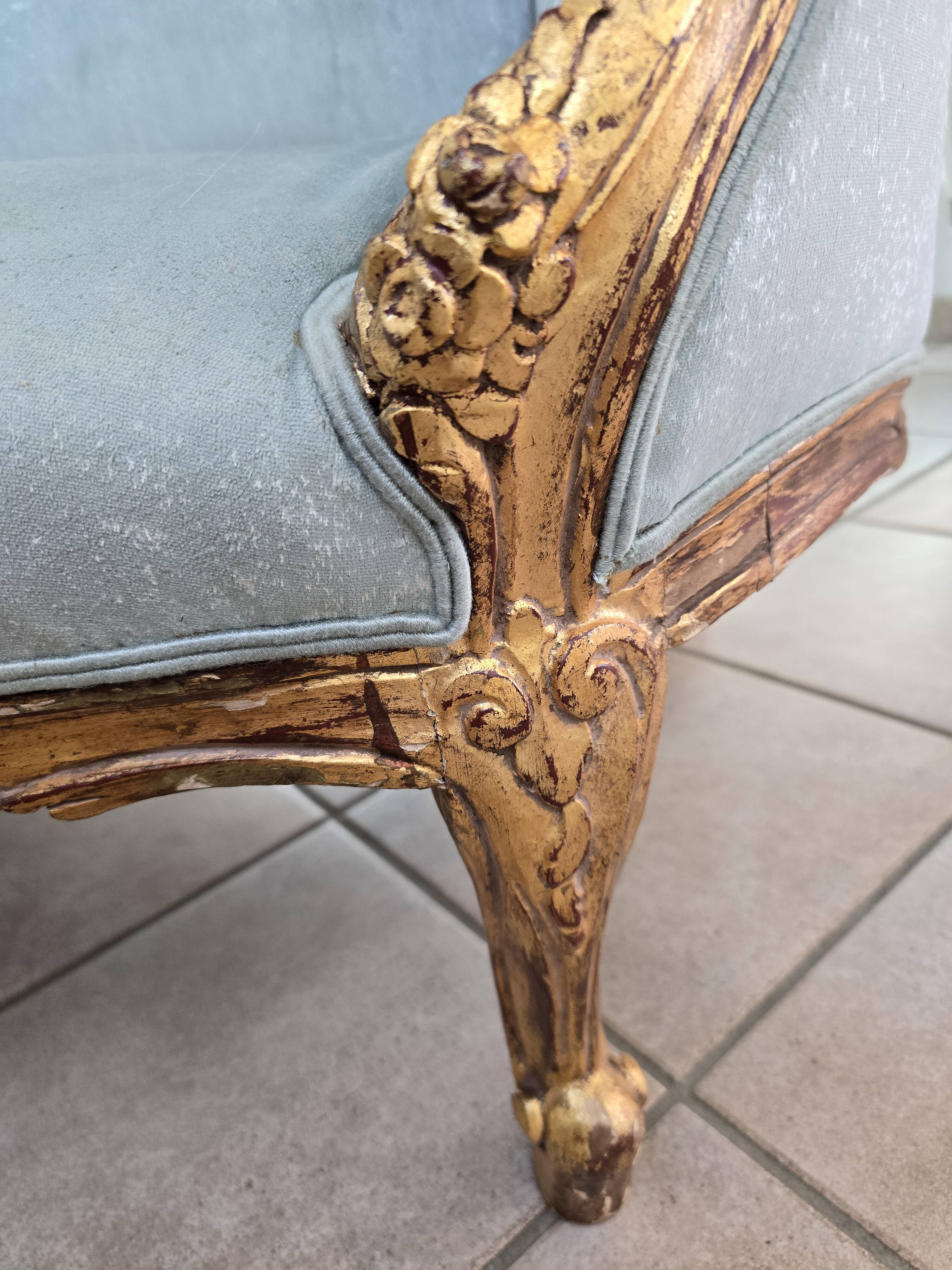 Louis XV gilt basket canapé with green velvet.