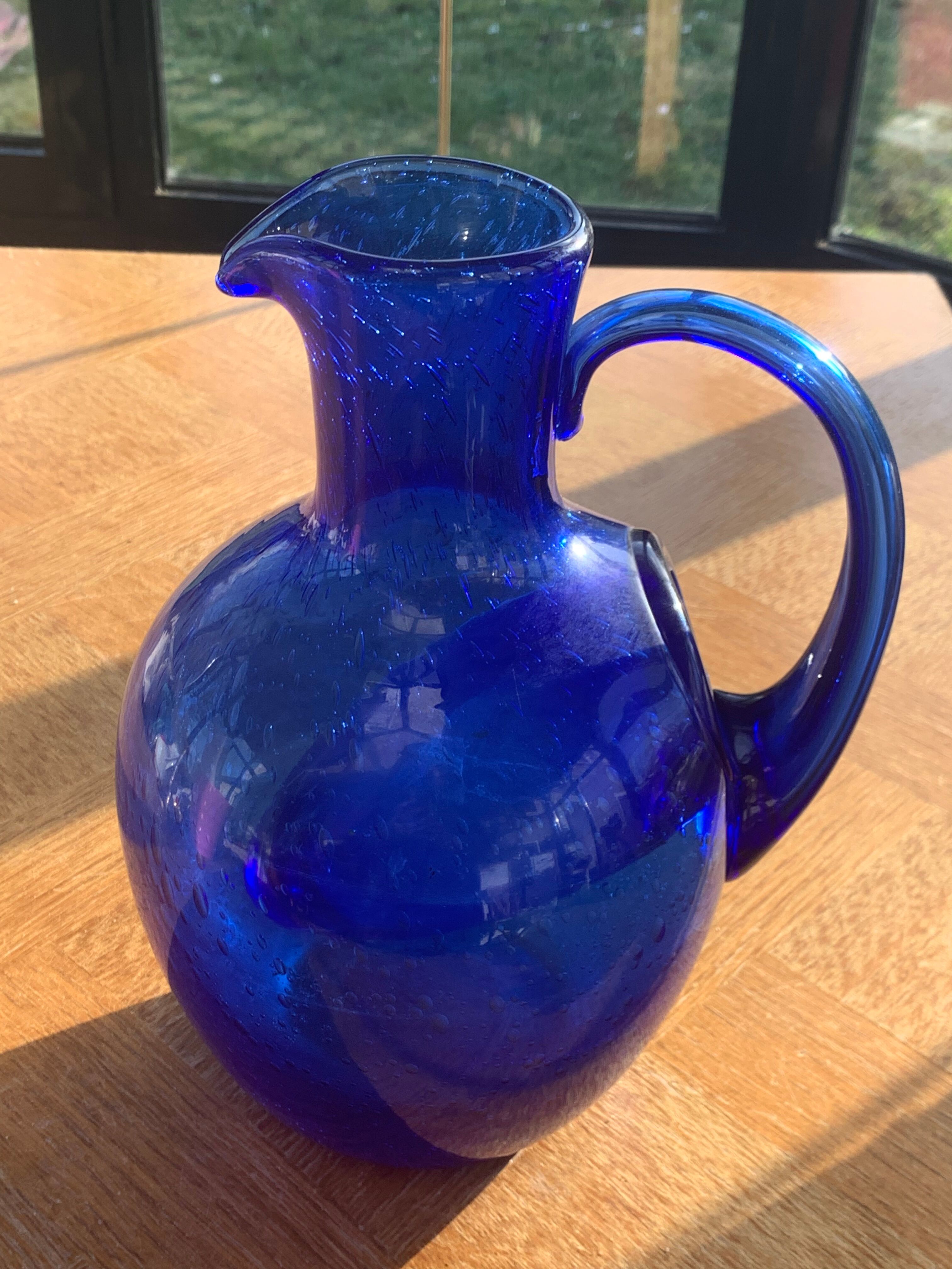 Blue blown glass ice decanter from vintage biot glassware