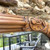 Beveled art deco mirror, carved wood