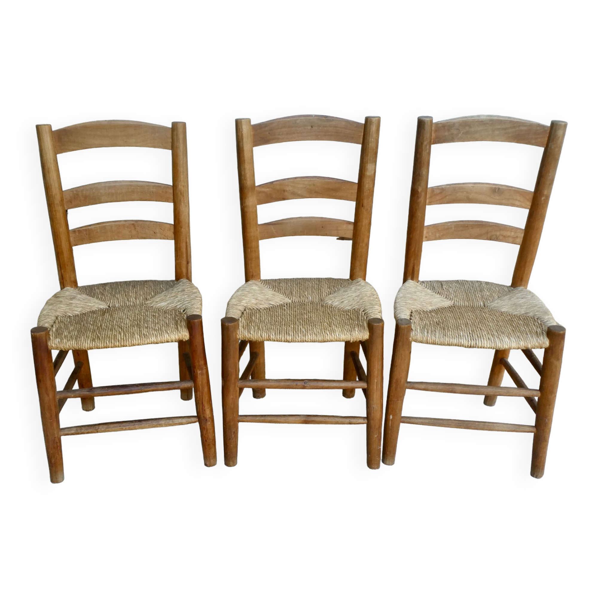 Trio of wooden chairs and mulched seat