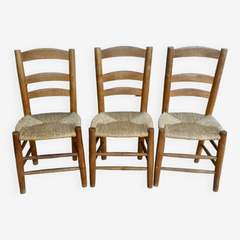 Trio of wooden chairs and mulched seat