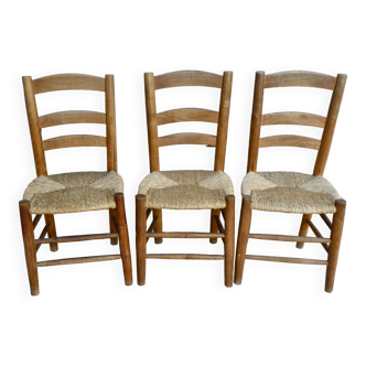 Trio of wooden chairs and mulched seat