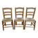 Trio of wooden chairs and mulched seat