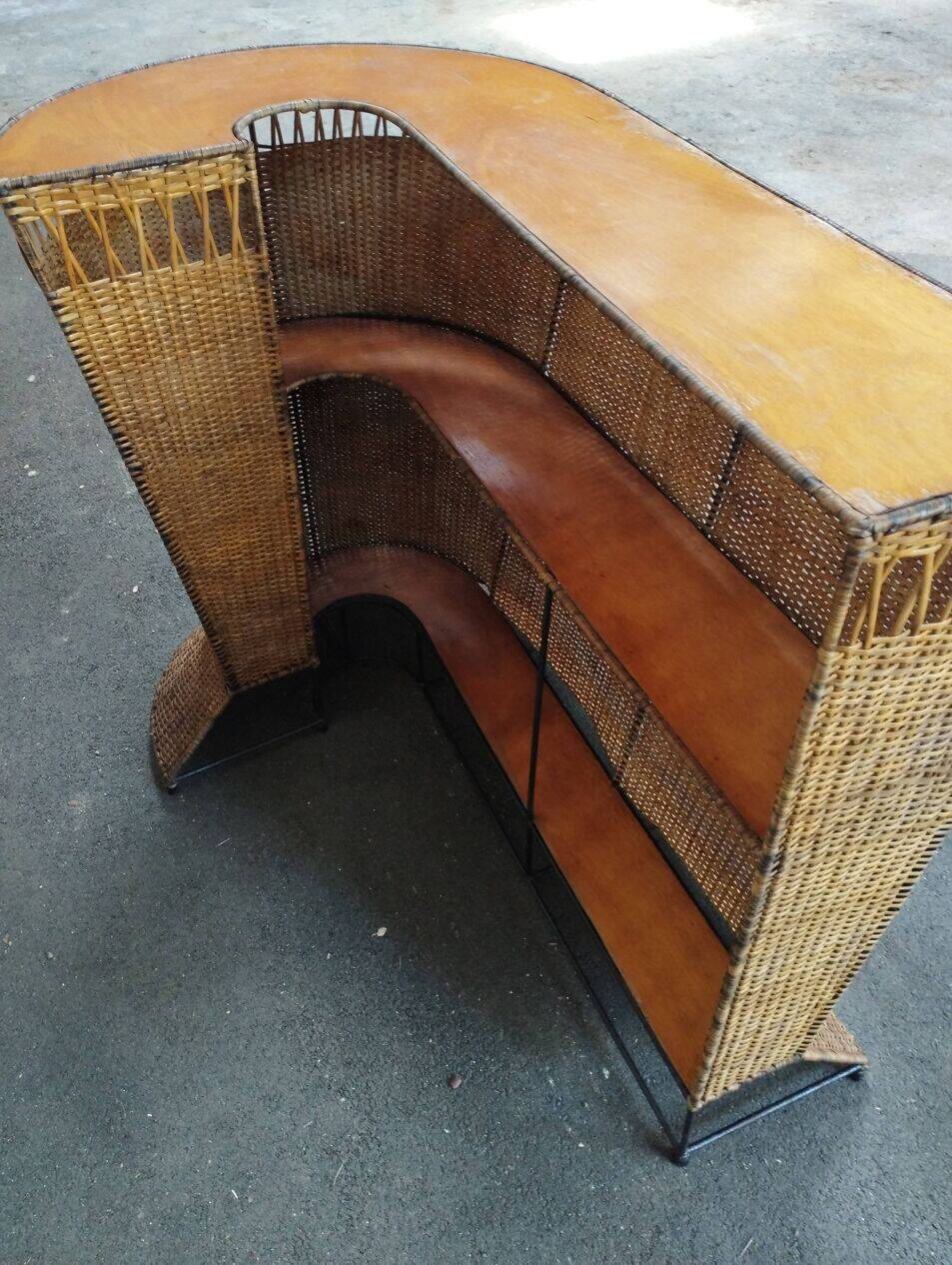 Vintage rattan and metal bar and its stools.
