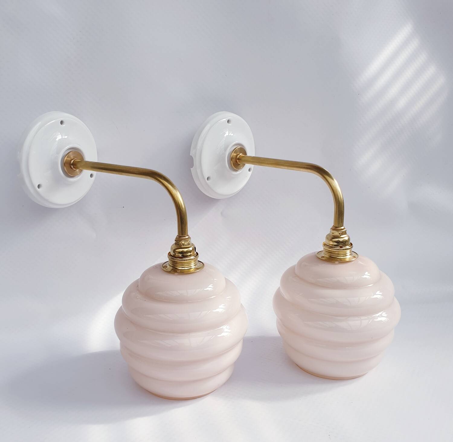 Swan neck and glass globe wall lights