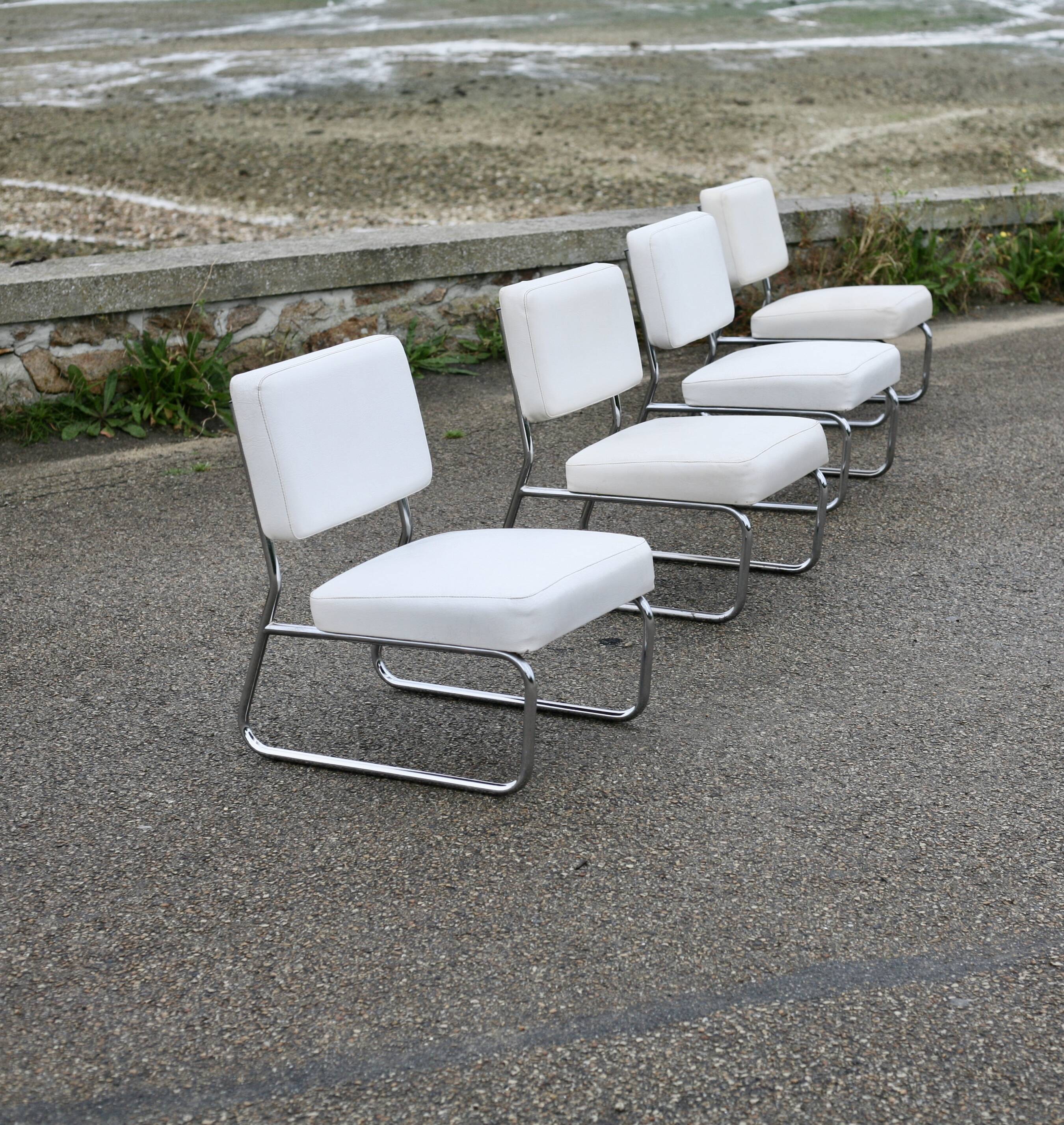 4 armchairs forming a modular sofa. Steel, imitation leather, 70s