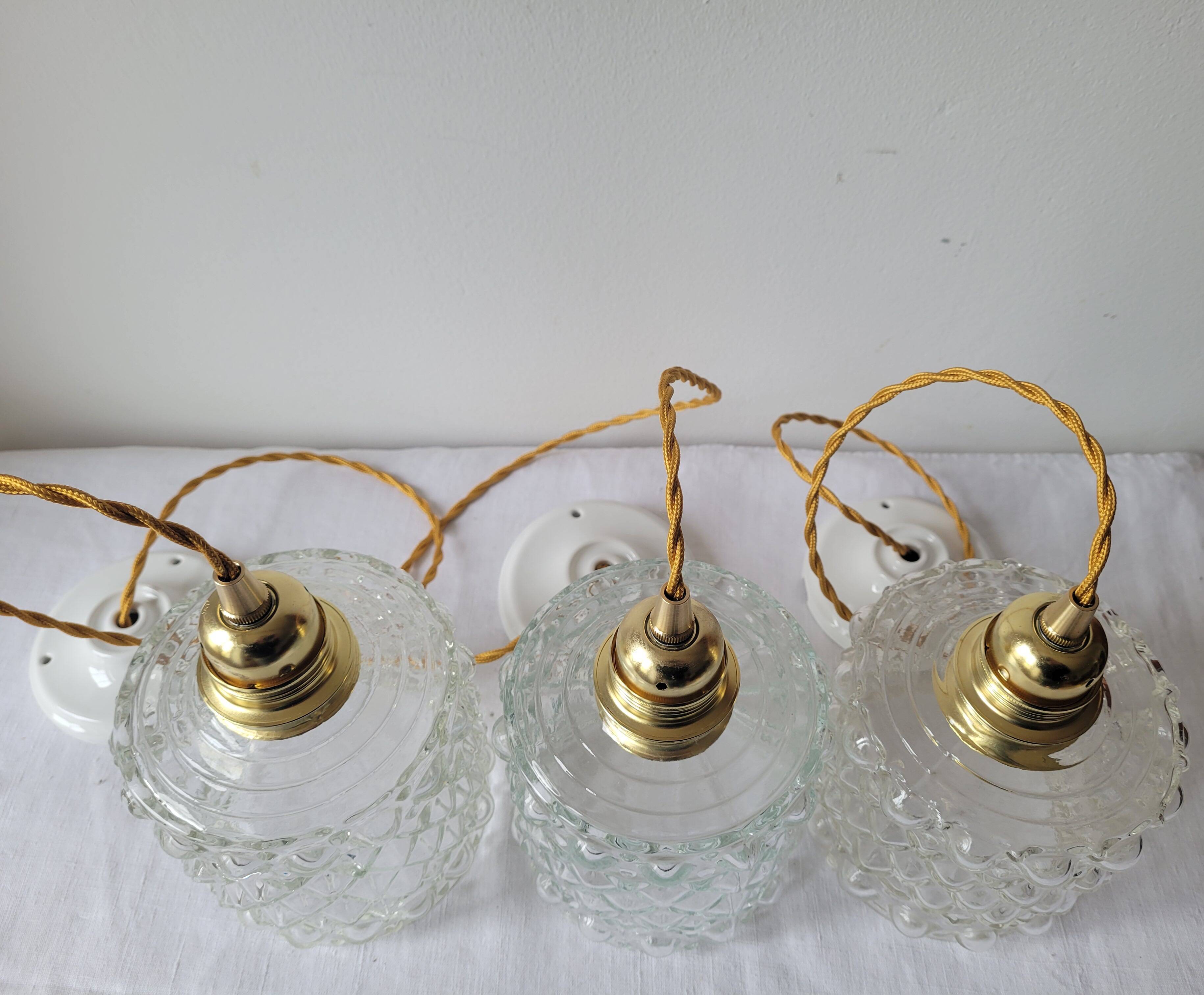 Trio of molded glass pendant lights