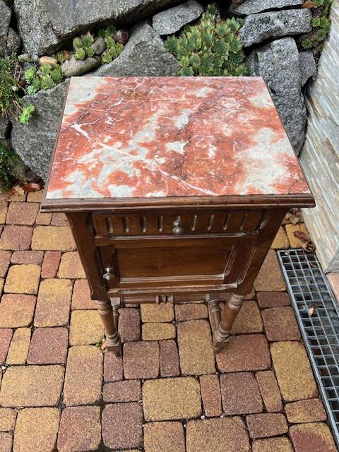 Wooden bedside table with marble top