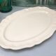 Oval ivory dish with gadroons, signed Sarreguemines France.
