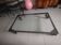 Industrial coffee table in solid metal with a glass top.