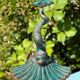 Antique candlestick base – stylised marine fish in patinated bronze