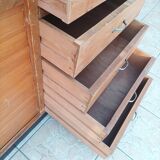 Workshop furniture with drawers and curtain in beech and walnut.