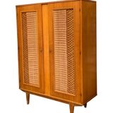 Rattan wardrobe and its compass-legged chest of drawers, 1960