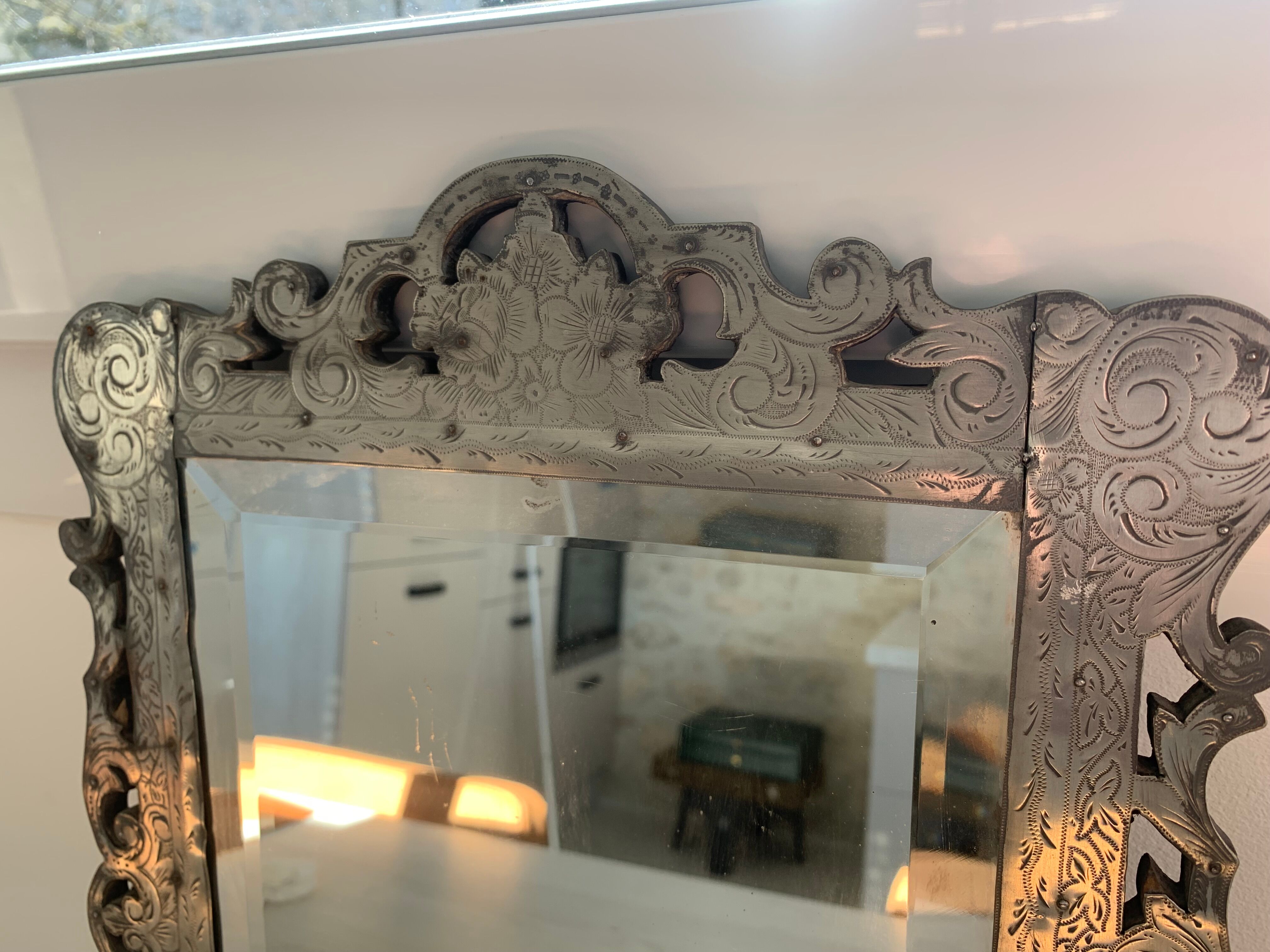 Eventful beveled mirror and openwork period 1900 repelled tin decoration