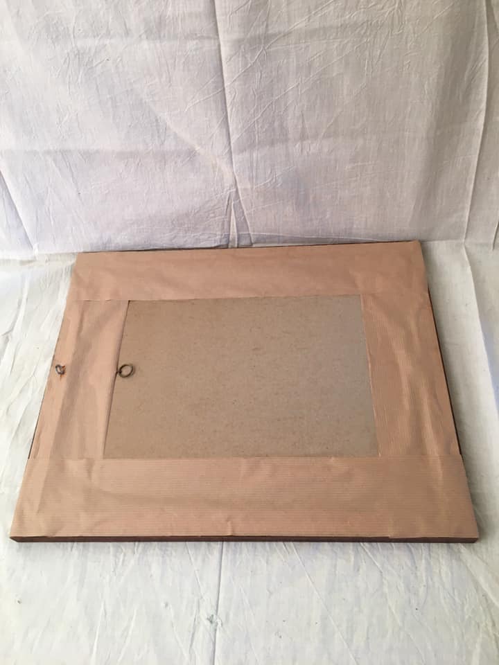 Table flowers under glass with wooden frame