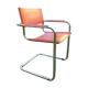 Design armchair with base in chrome tubular steel and seat in brown leather