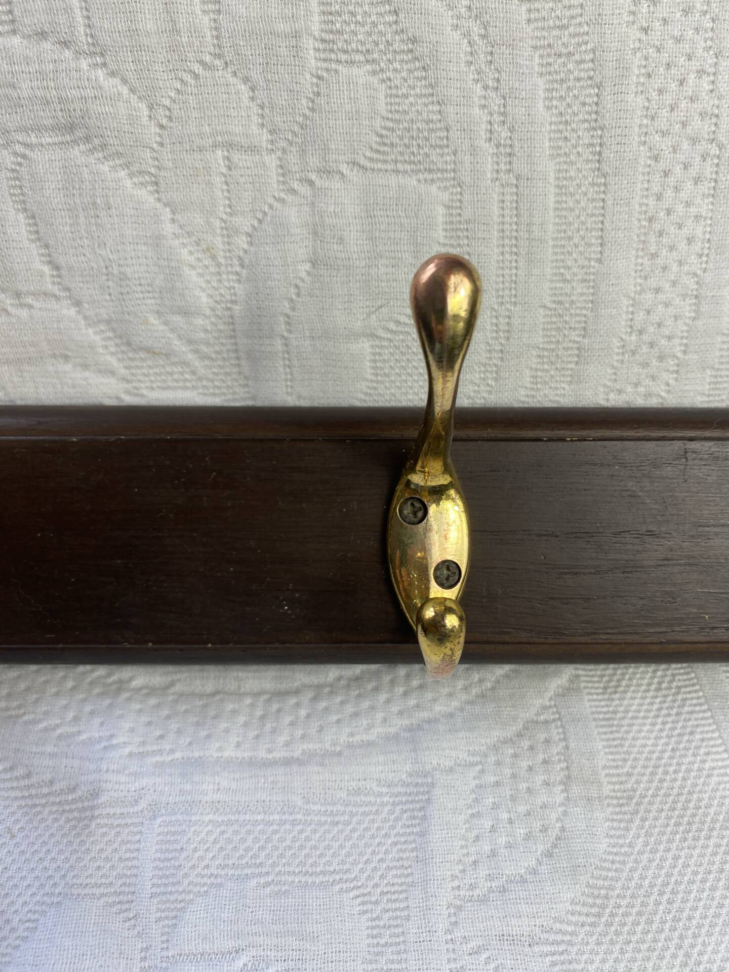 Wooden coat rack with double brass hooks