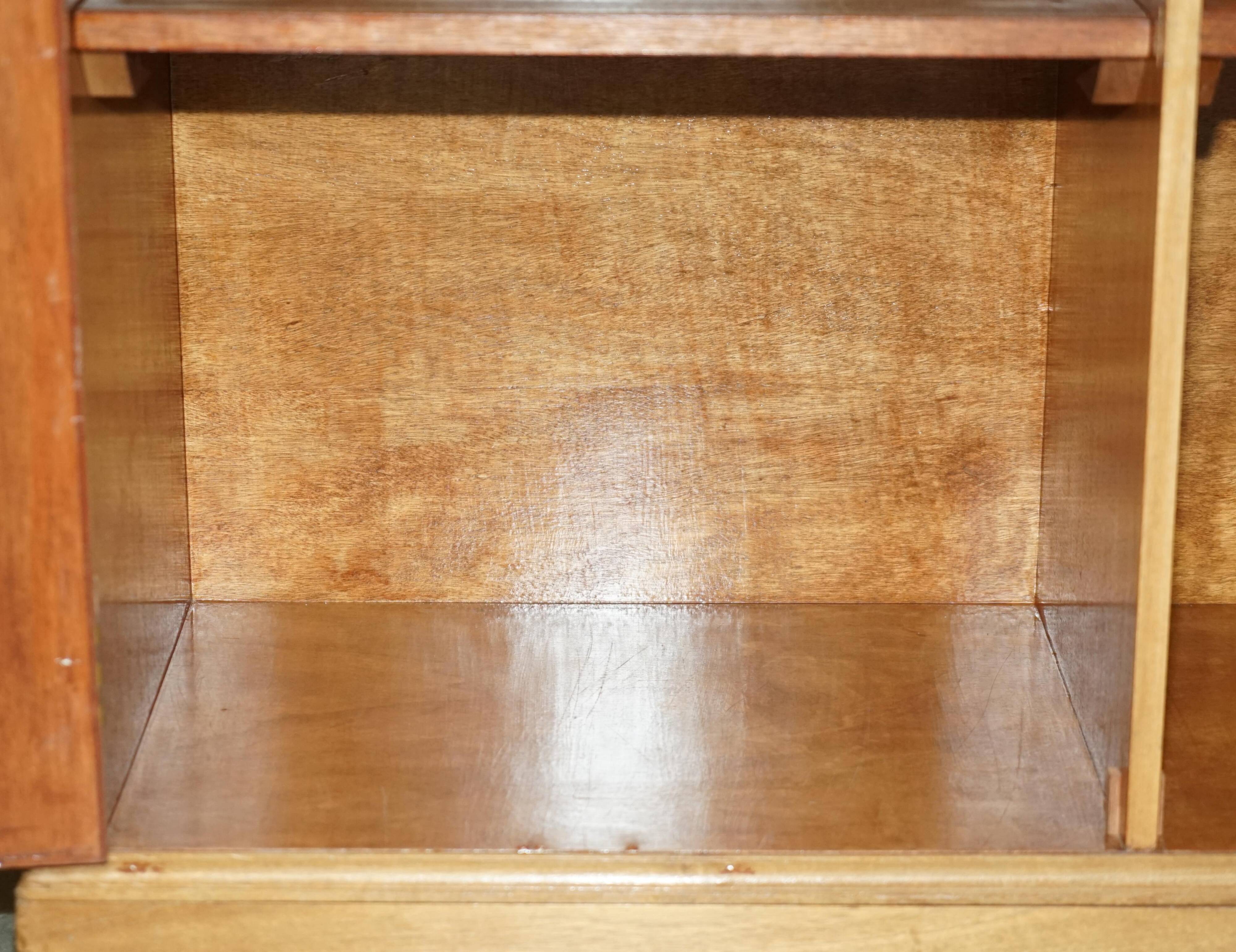 Library in the style of David Linley in satinwood, walnut, and rosewood.