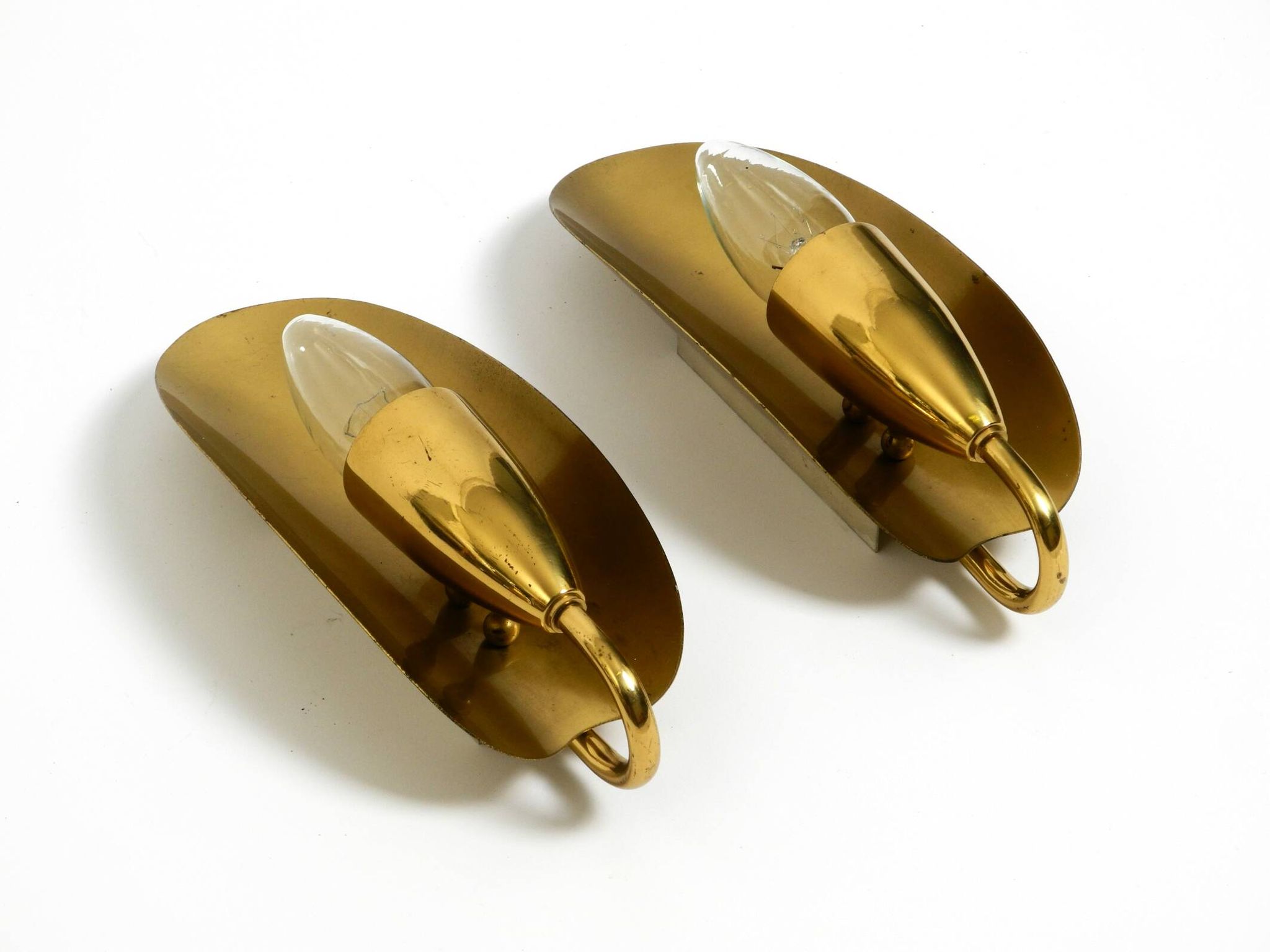 Two magical original Mid Century Modern bag brass wall lamps