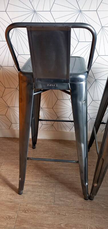 Pair of tolix hpd 75 stools – in varnished raw steel.