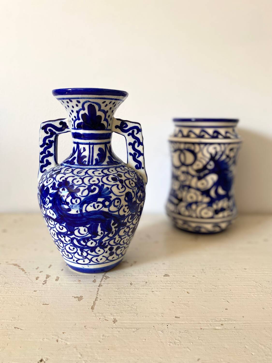 Small amphora vase in old hand-painted ceramic