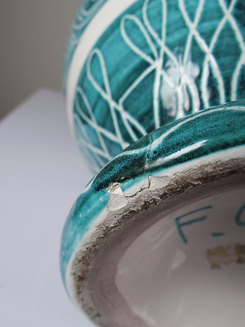Vintage turquoise ceramic baluster vase with incised decoration.