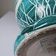 Vintage turquoise ceramic baluster vase with incised decoration.