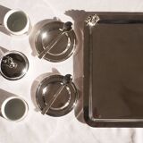 Silver-plated metal coffee service with a grape design.