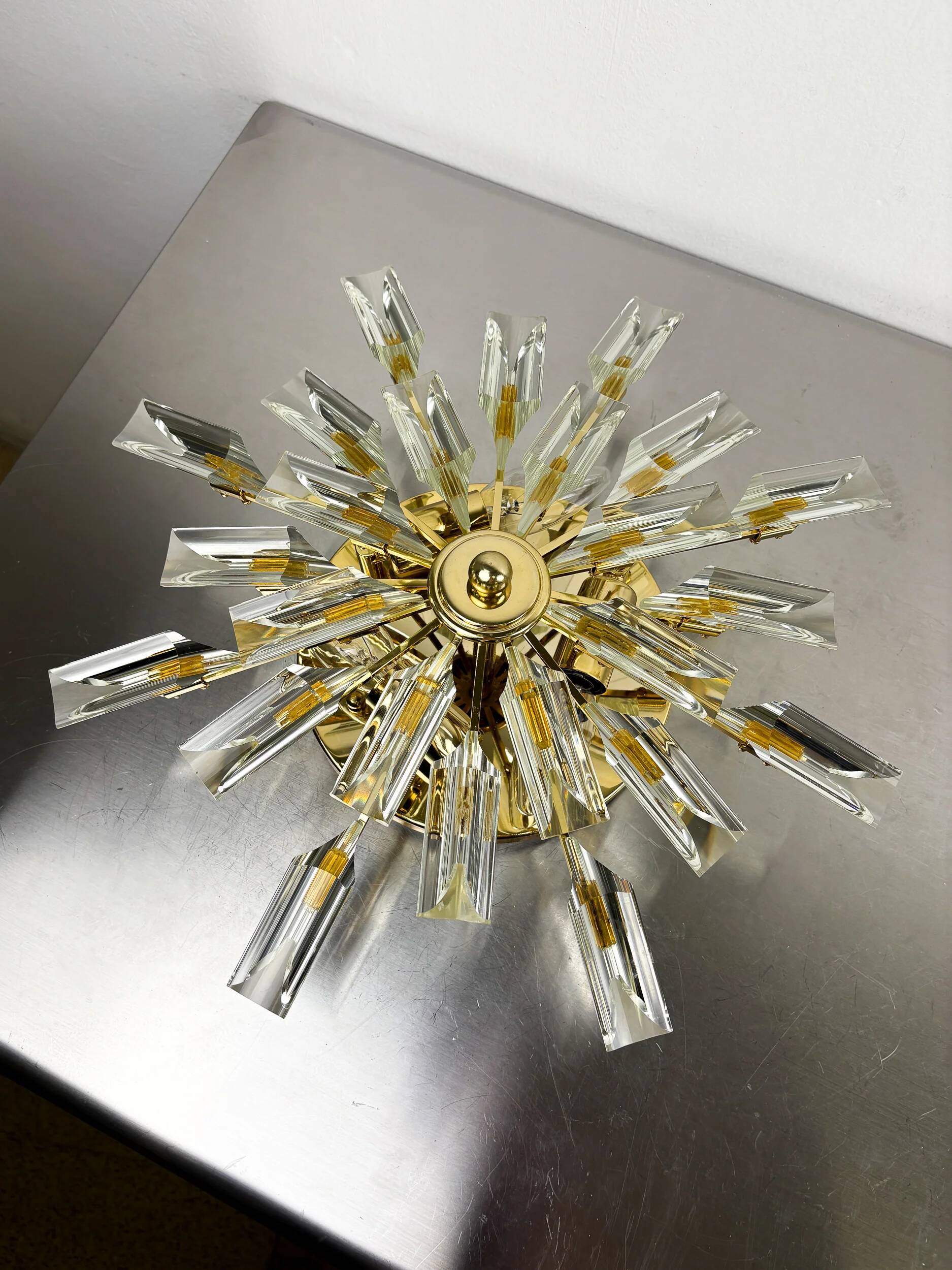 Sun-shaped ceiling or wall light by Oscar Torlasco for StilKronen, cut Murano glass, Italy, 1970s