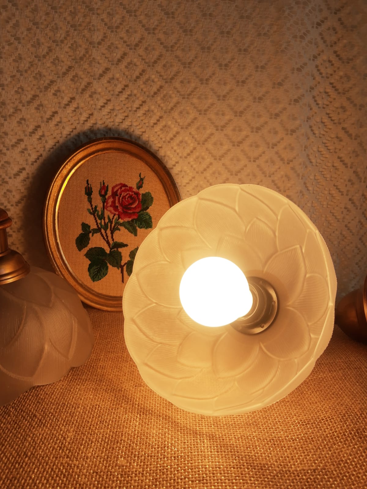 Pair of frosted glass flower pendant lights with vintage wood and brass
