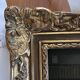 Framed reproduction painting with a golden frame.