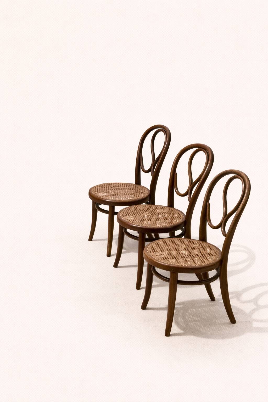 Set of three vintage bentwood bistro chairs – Cane seat – Mismatched