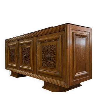 According to Charles Dudouyt: sideboard in a row from the Art Deco period in solid wood.