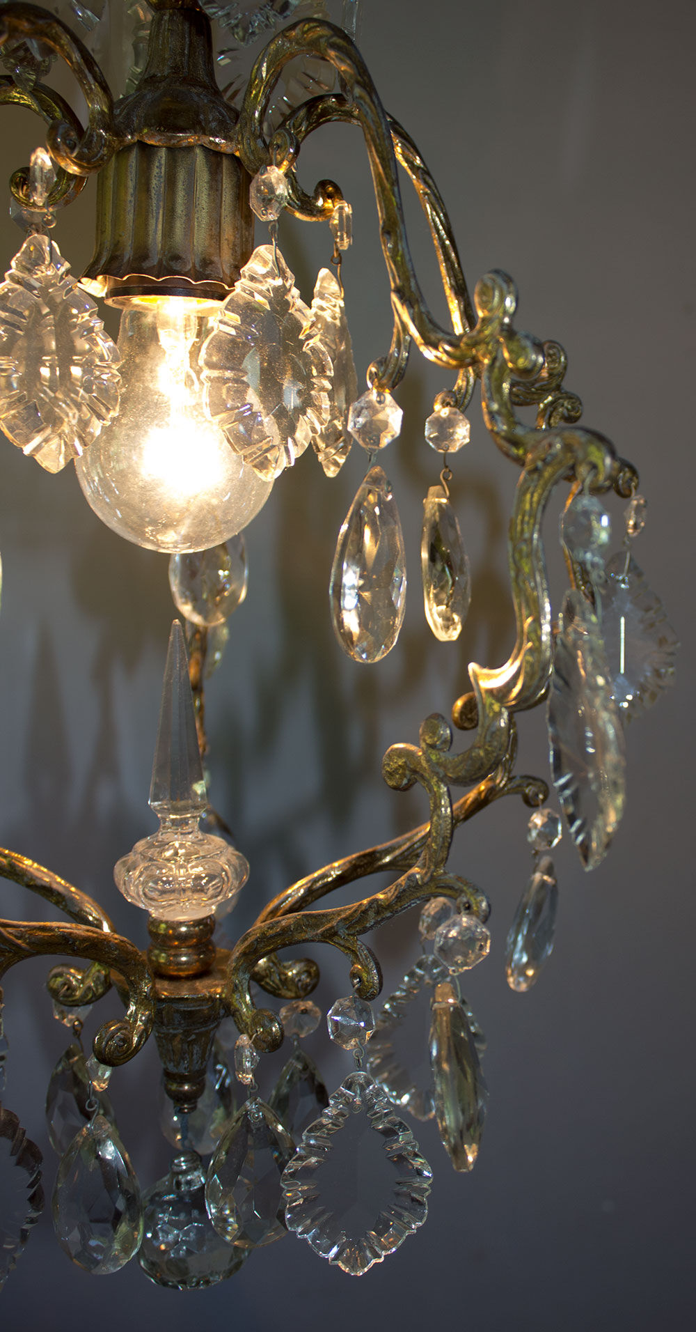 Old brass chandelier with glass stamps