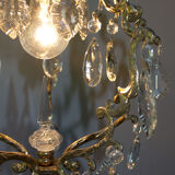 Old brass chandelier with glass stamps