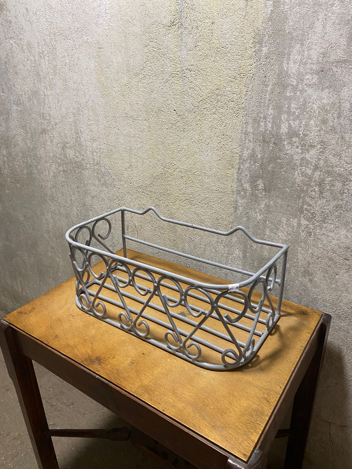 Gray wrought iron shelf