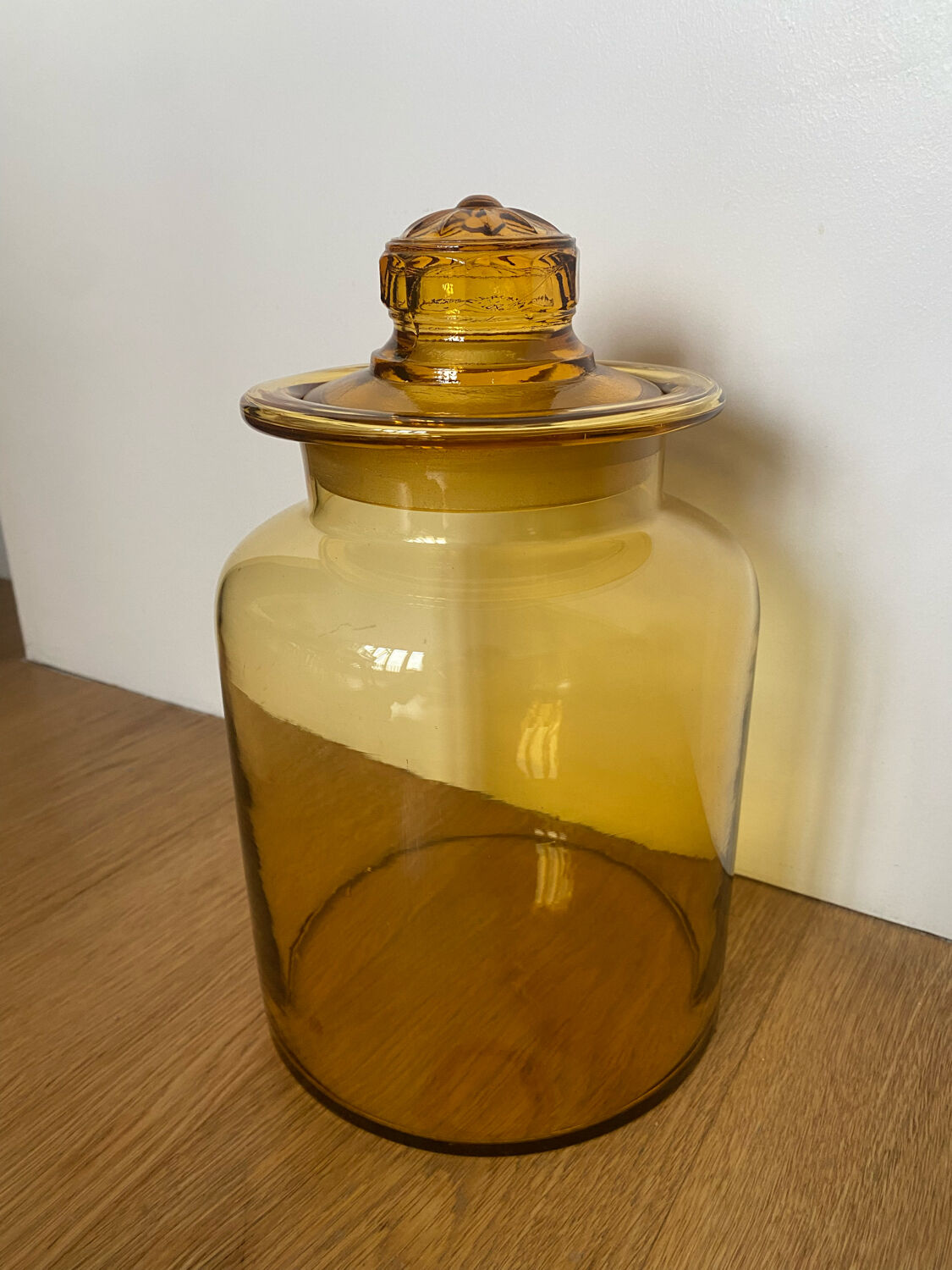 Old apothecary jar in blown amber glass