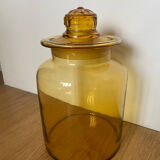 Old apothecary jar in blown amber glass