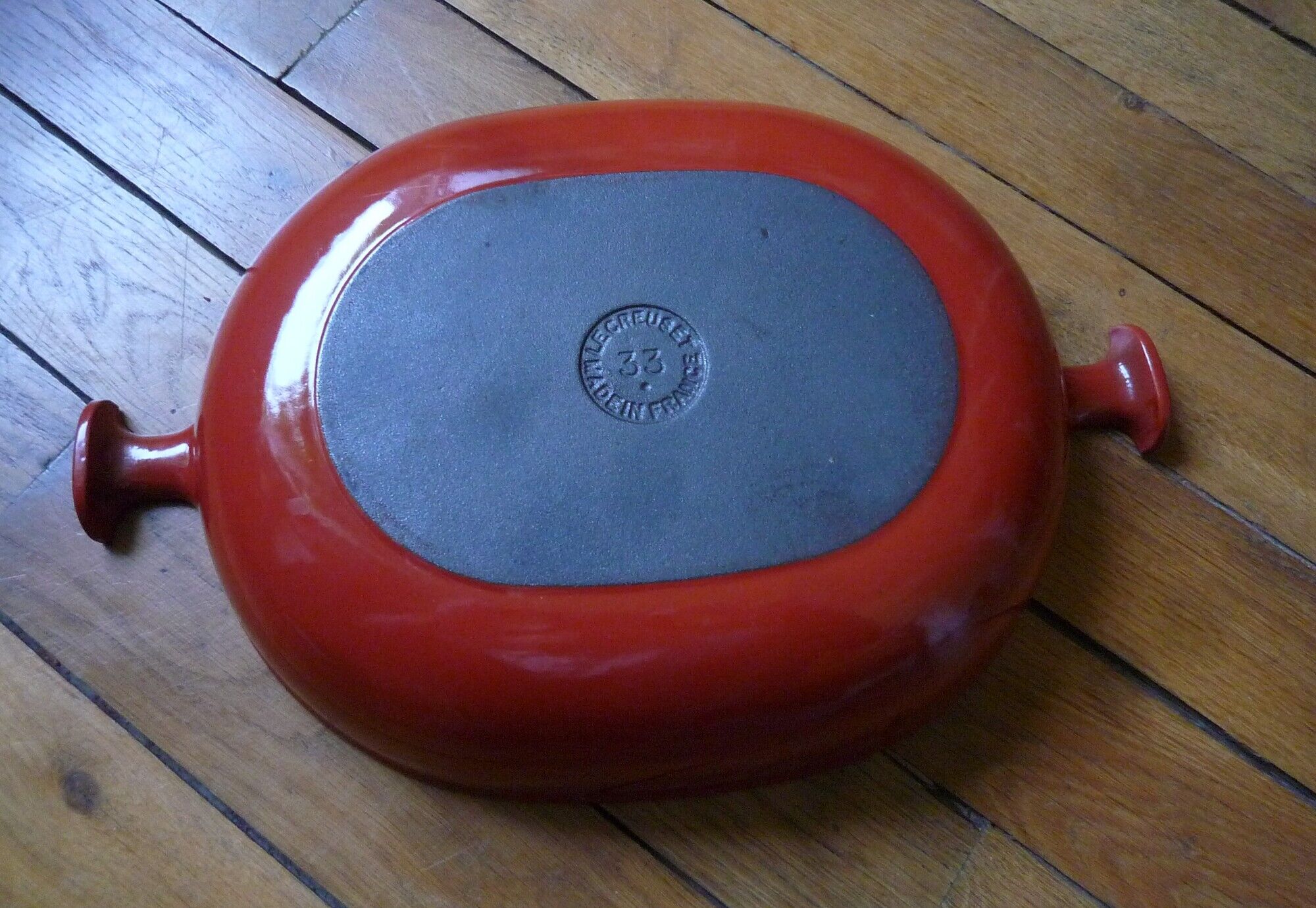 Le Creuset dish by Enzo Mari, in red cast iron, 70s