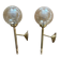 Pair of antique wall sconces torch style brass with glass globes in gold.