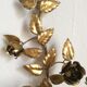 Leaves and flowers wall light in gold metal