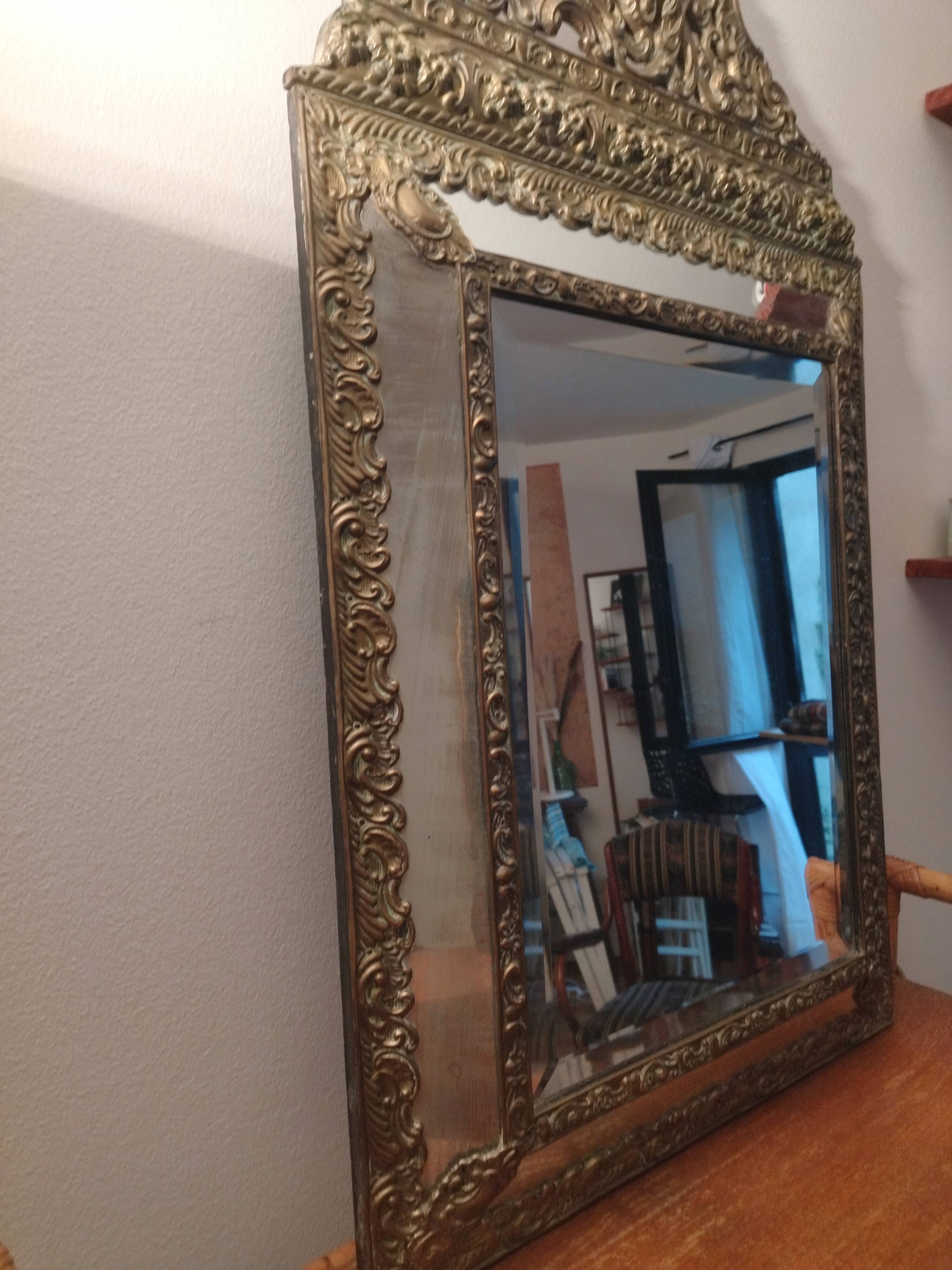 Repelled brass pareclose mirror