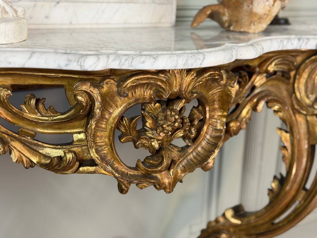 Louis XV style console in carved and gilded wood, circa 1880.