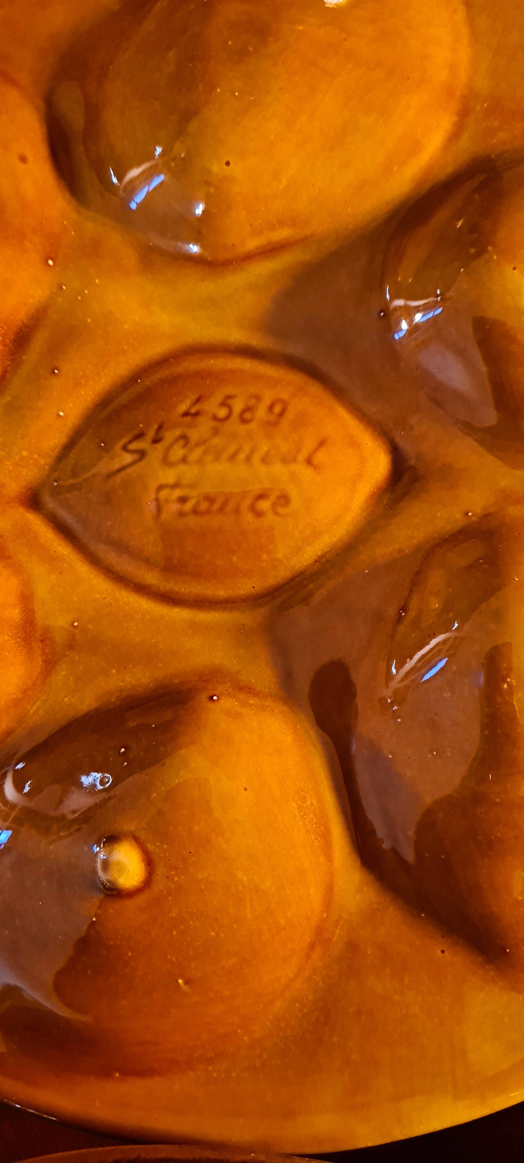 Six oyster plates signed Saint Clément