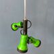 Vintage pendant light with three green spots.