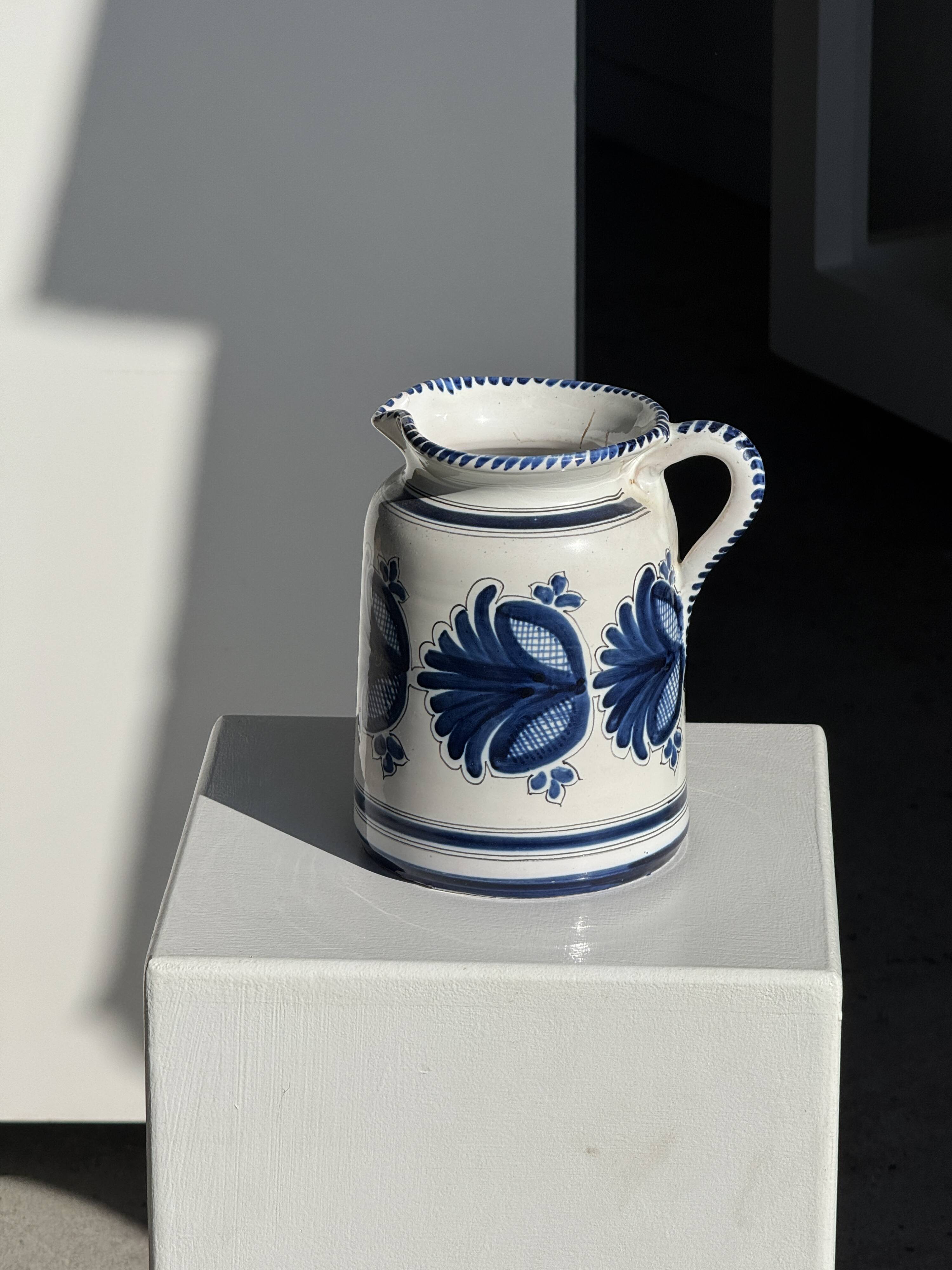 Artisan blue floral decorative carafe, height 17 cm, diameter 24.5 cm.