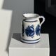 Artisan blue floral decorative carafe, height 17 cm, diameter 24.5 cm.